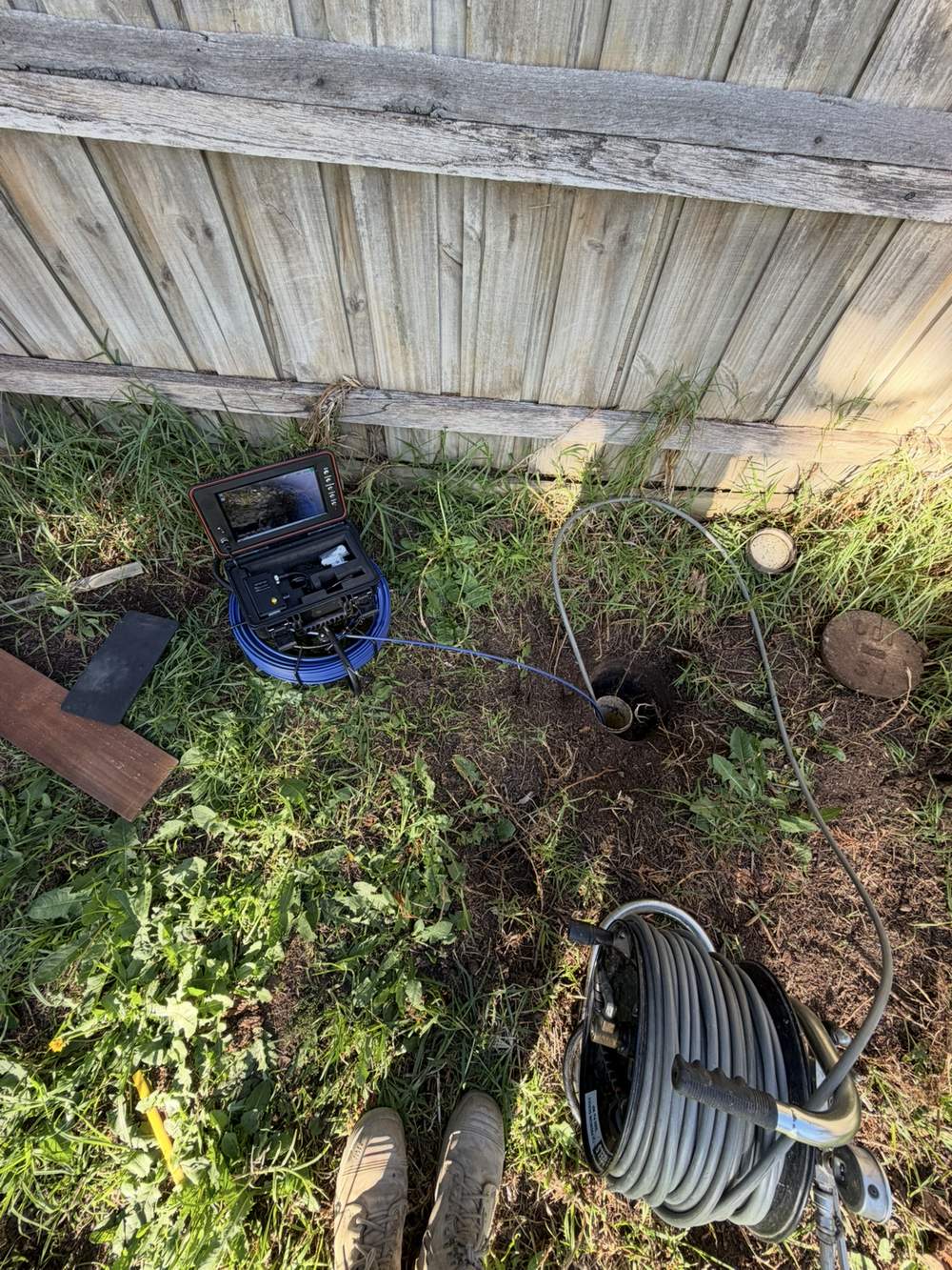 CCTV drain camera equipment set up at a sewer access point during a tree root investigation in Narre Warren